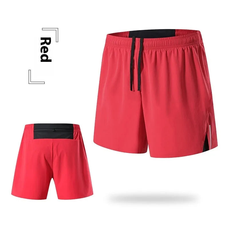 Men's red off-road running shorts with high waist and loose fit on a running trail.