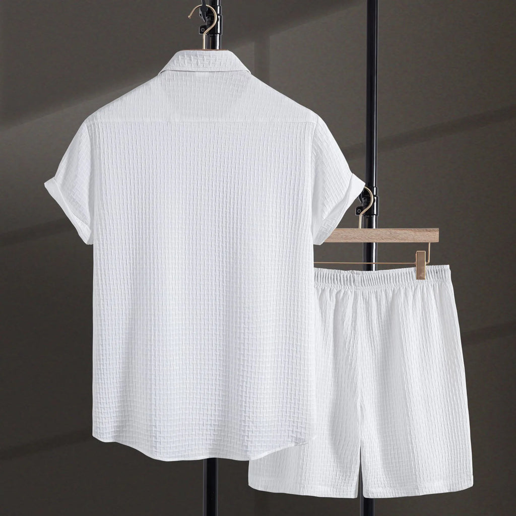 Men's loose fit cotton blend short sleeve shirt and shorts set in white, laid out flat.