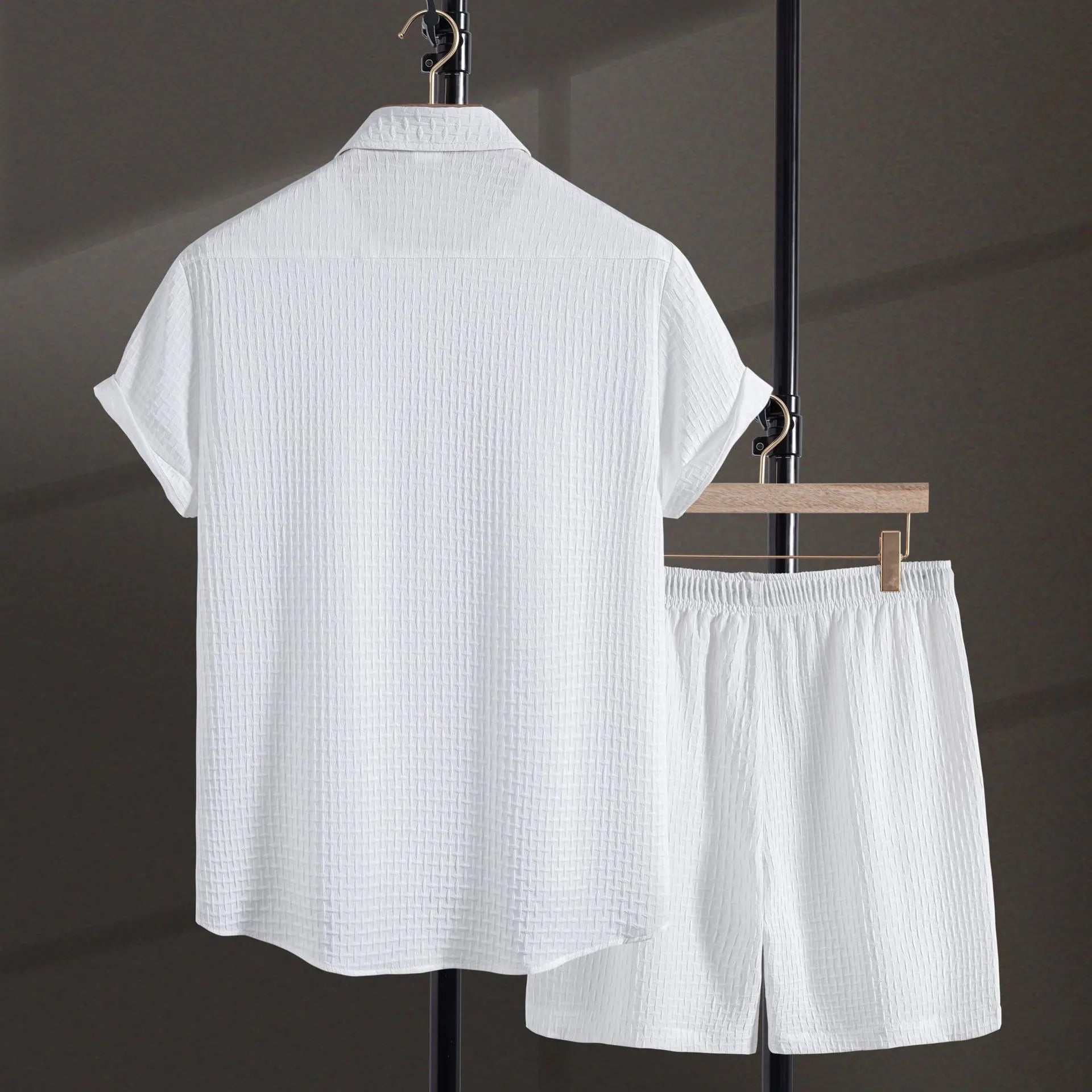 Men's loose fit cotton blend short sleeve shirt and shorts set in white, laid out flat.