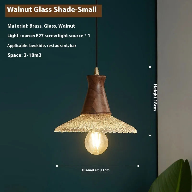 Retro wood and brass chandelier with glass shade in three size options for ceiling mounting.