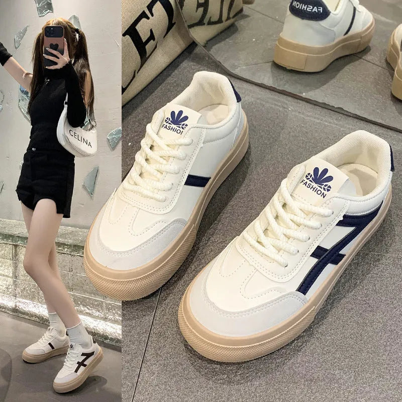 Low-top lace-up board shoes in brown or blue with patent leather-look finish and round toe