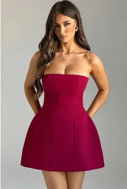 Women's backless solid colour tube dress with high waist and A-line short skirt.