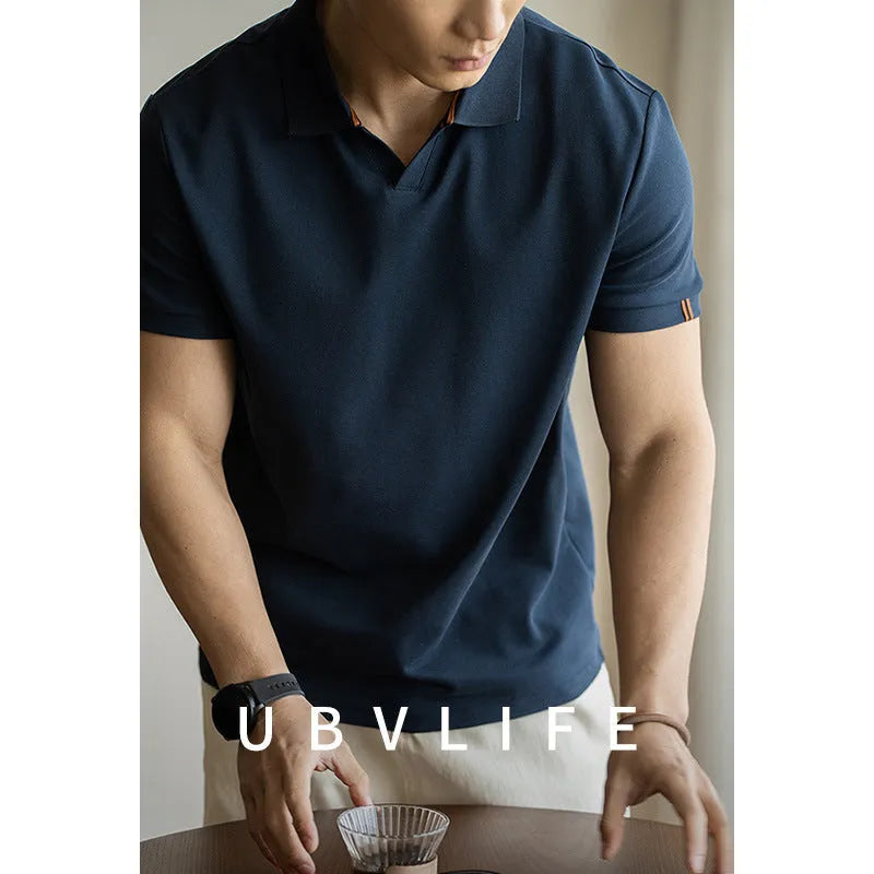 American-style cotton blend short-sleeved polo shirt in blue, shown in a regular fit for casual summer wear.