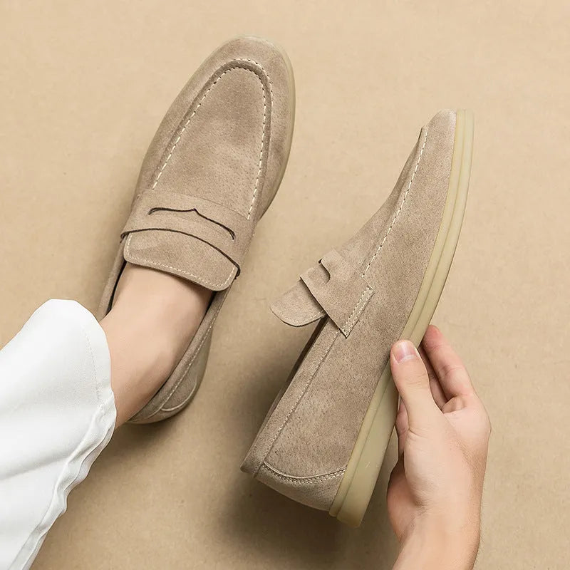 Men's leather slip-on casual shoes in beige with a rounded toe and rubber sole.
