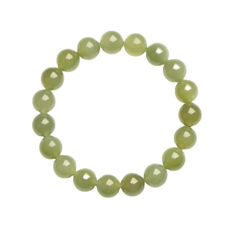 Polished Hetian jade ball bracelet showing spherical beads on a wrist, available in deep or shallow ice-clear colours.