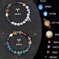 Set of twelve natural stone beaded bracelets, each for a different zodiac sign, on a flat surface.