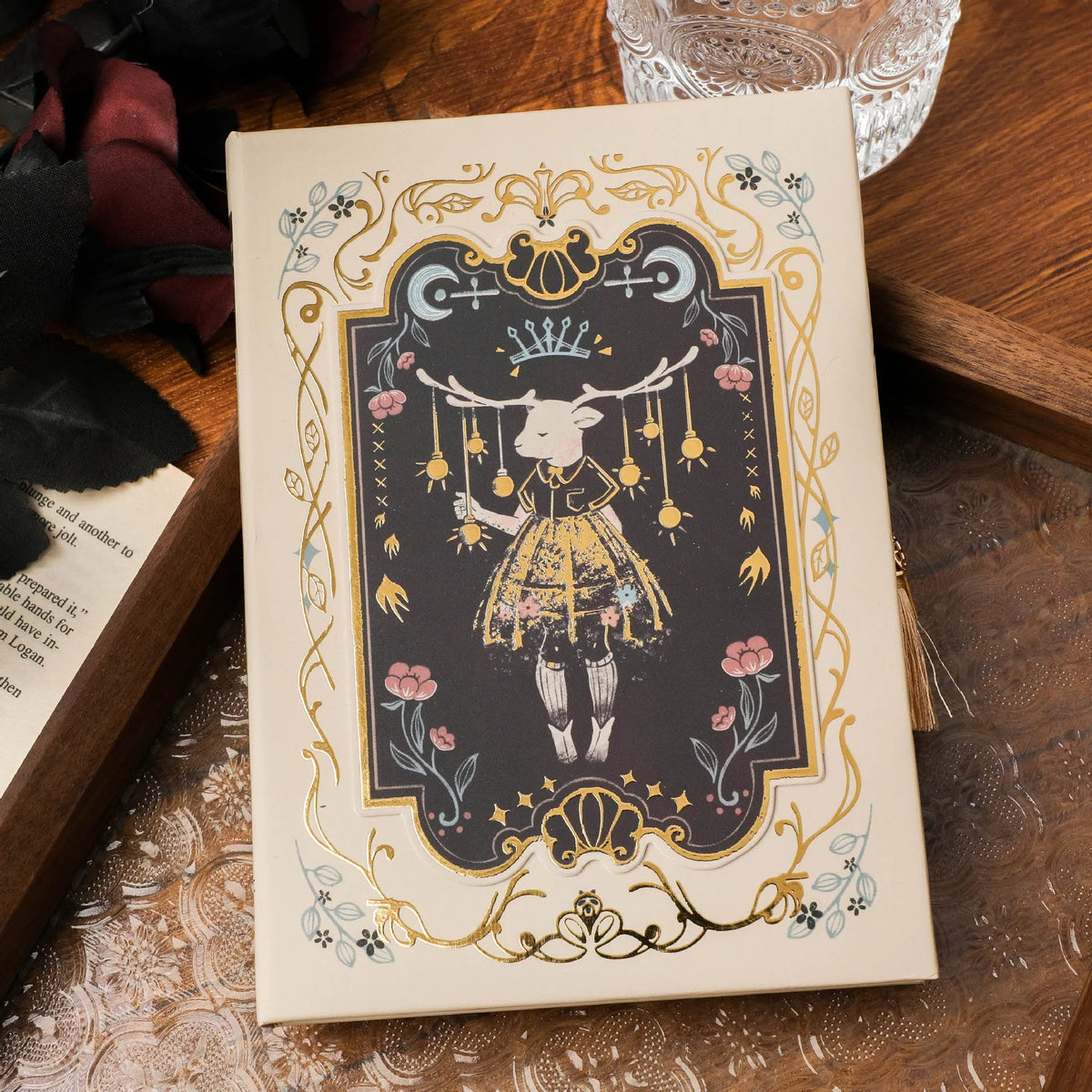 Retro gothic style A5 notebook open on a table, showing detailed cover art and wood pulp paper pages.