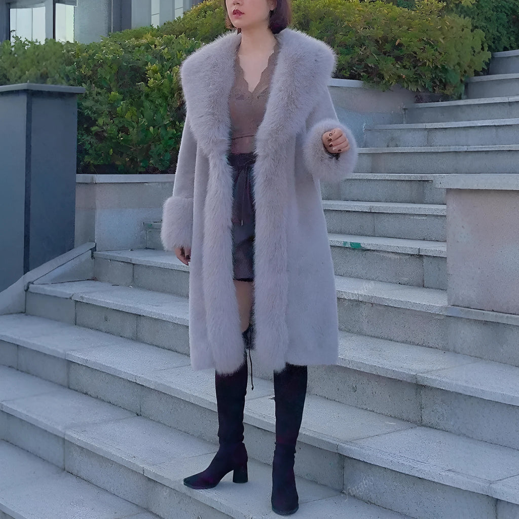 Women's grey thick faux rabbit fur mid-length coat with regular sleeves on a hanger.