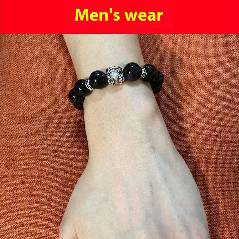 A silver and black obsidian bead bracelet showing lucky colour eye pattern, displayed in two sizes.