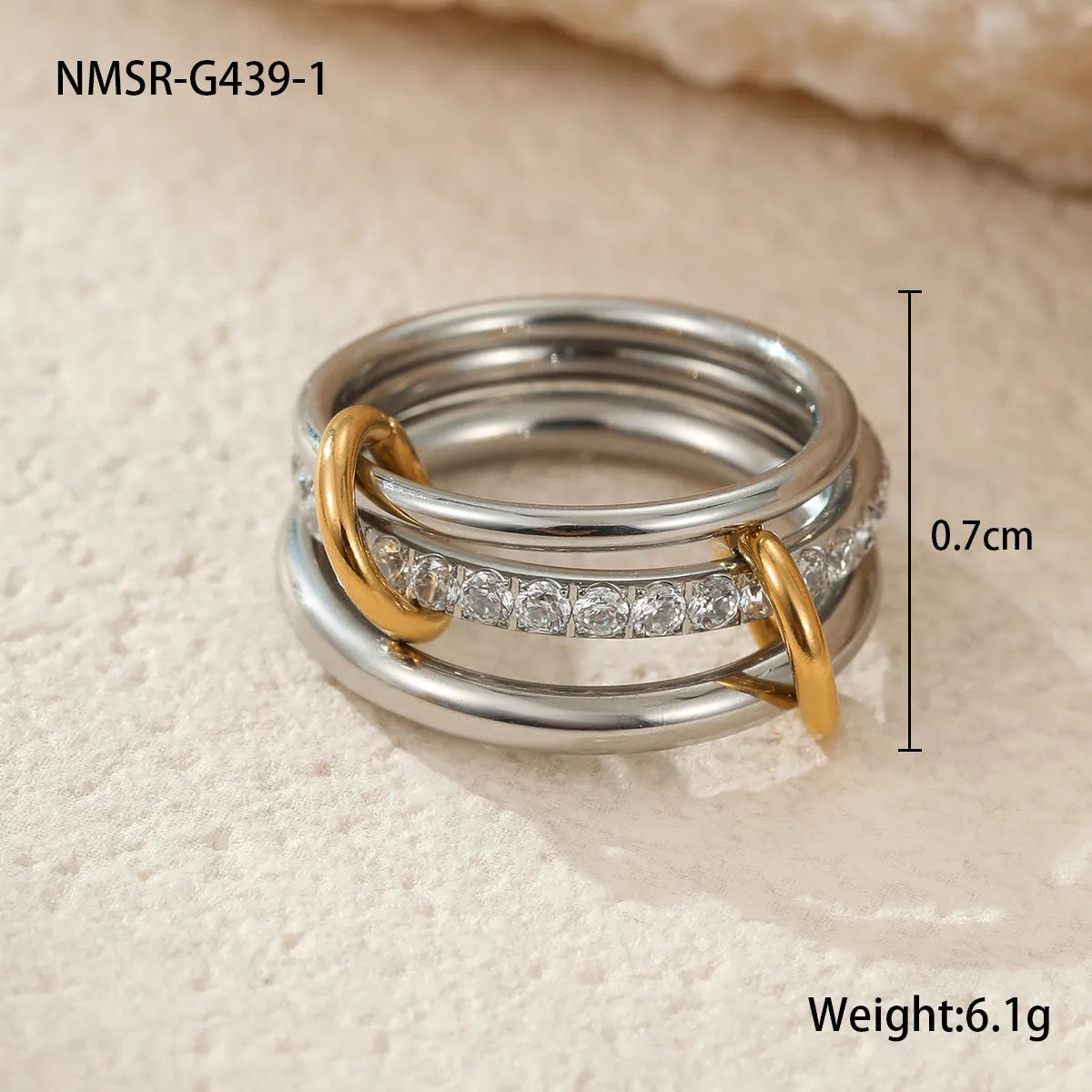 Stacked colour matching stainless steel rings with 18K gold electroplating in exaggerated jewellery styles