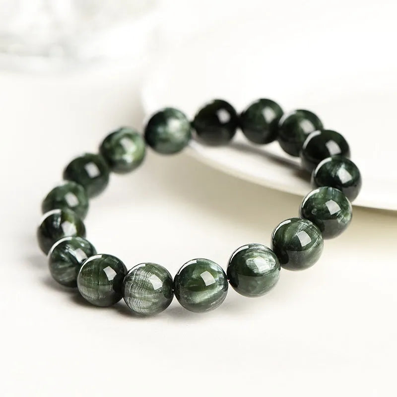Green dragon crystal bracelet with 8-9mm round beads and ruyi charm on wrist