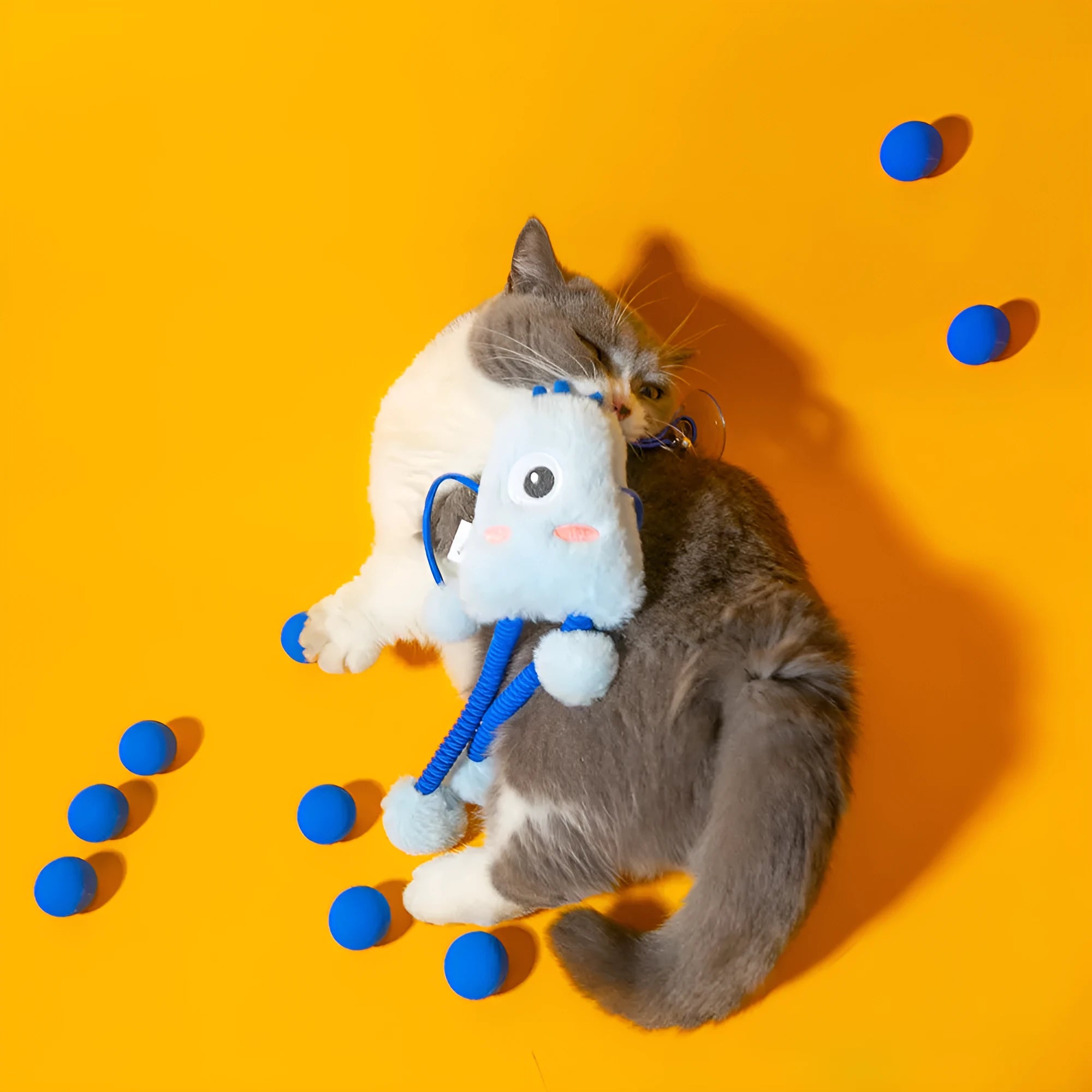 Blue plush telescopic elastic cat toy with a metal mint bell on a 30cm elastic rope.