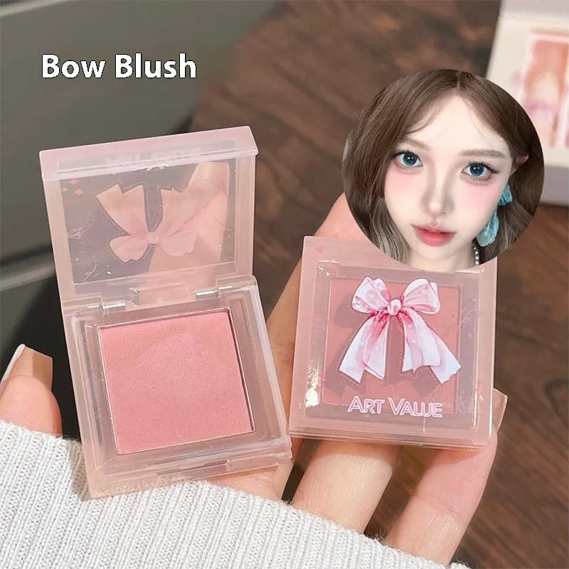 Butterfly Box makeup set showing four lip mud containers, powder blusher, and necklace in pink packaging