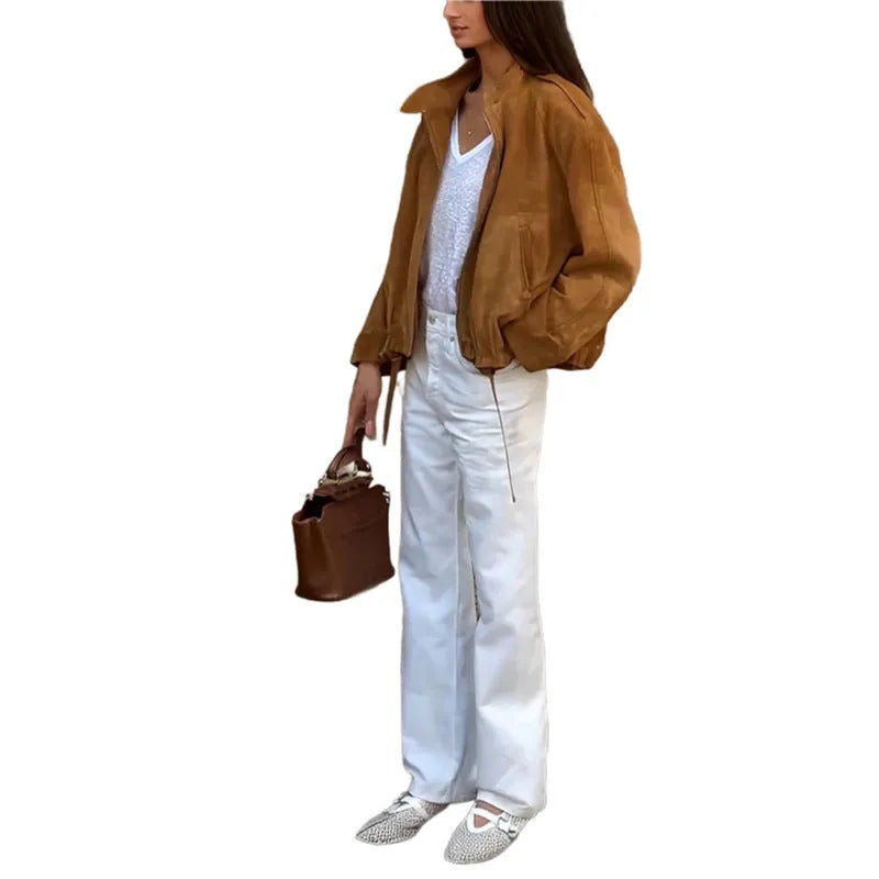 Solid colour loose-fit polyester jacket with long sleeves on a hanger