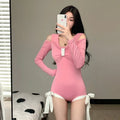 Women's long sleeve one-piece swimsuit in polyester fabric available in black or pink colours