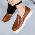 Men's casual PU leather slip-on loafer in British style with round toe, shown in khaki colour.