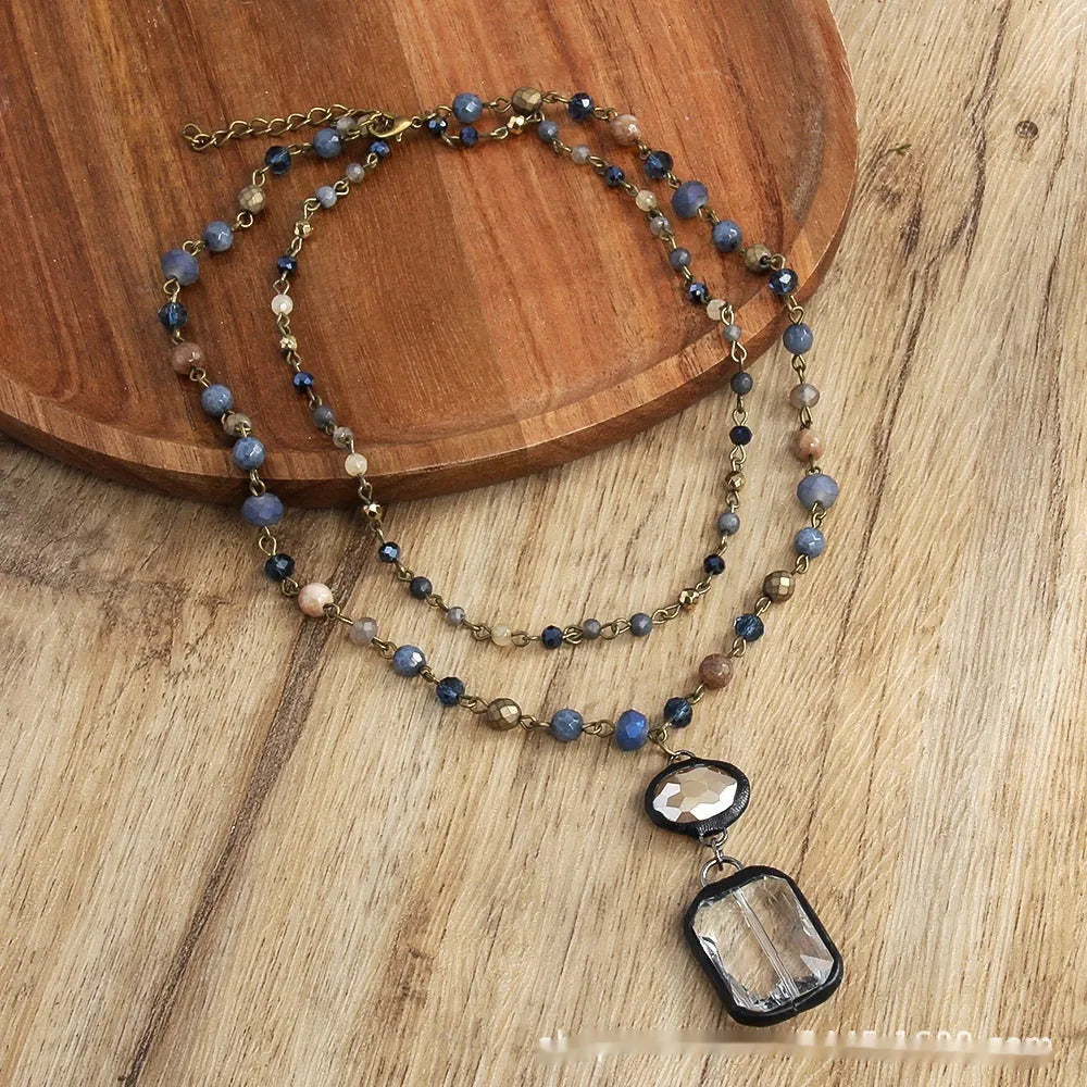 Tribal two-layer necklace with glass pendant and stone elements on adjustable chain