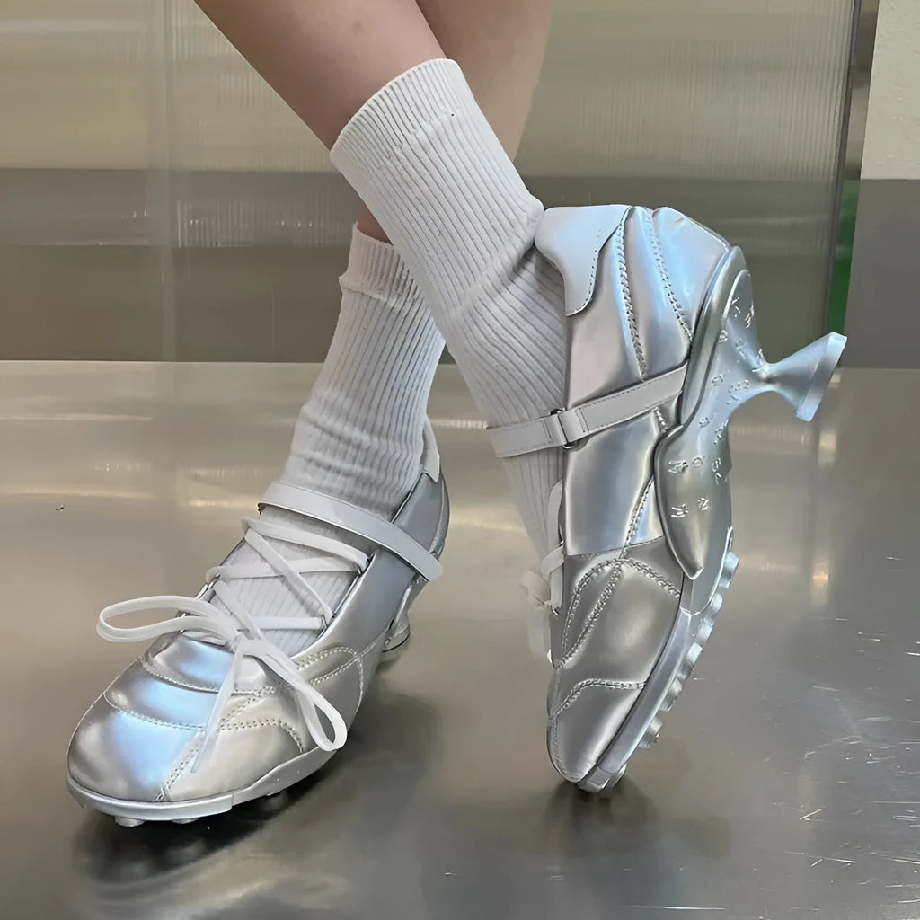 Women's silver lace-up bow sports shoes with round toe and low-top design on a white background.