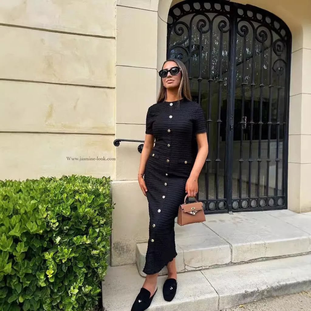 French retro slim fit knitted long sleeve dress in black with button detail and one-step skirt