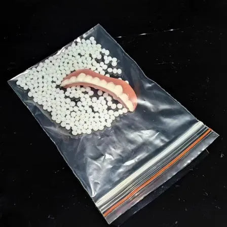Silicone simulation smile dentures with upper and lower teeth in colour box packaging for dental training