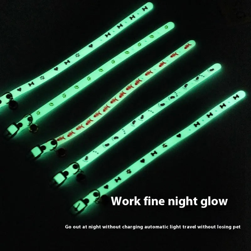 Cat luminous collar with adjustable silicone strap and metal bell showing paw print pattern