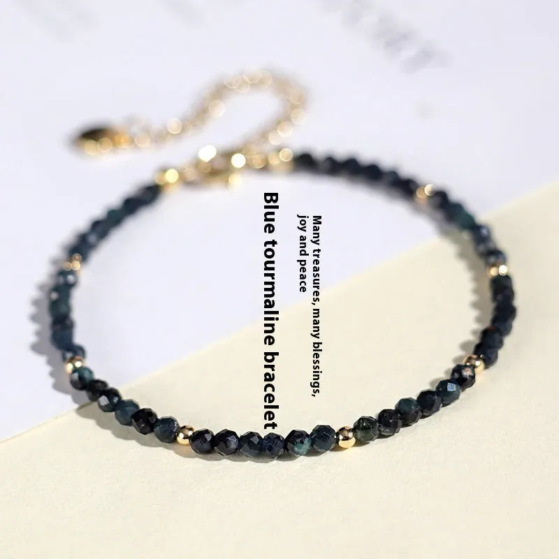Blue tourmaline bracelet with 3mm cut beads and spacer bead design