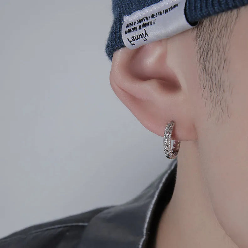 Silver geometric copper stud earrings for men in 10mm and 14mm sizes, shown singly and as a pair.