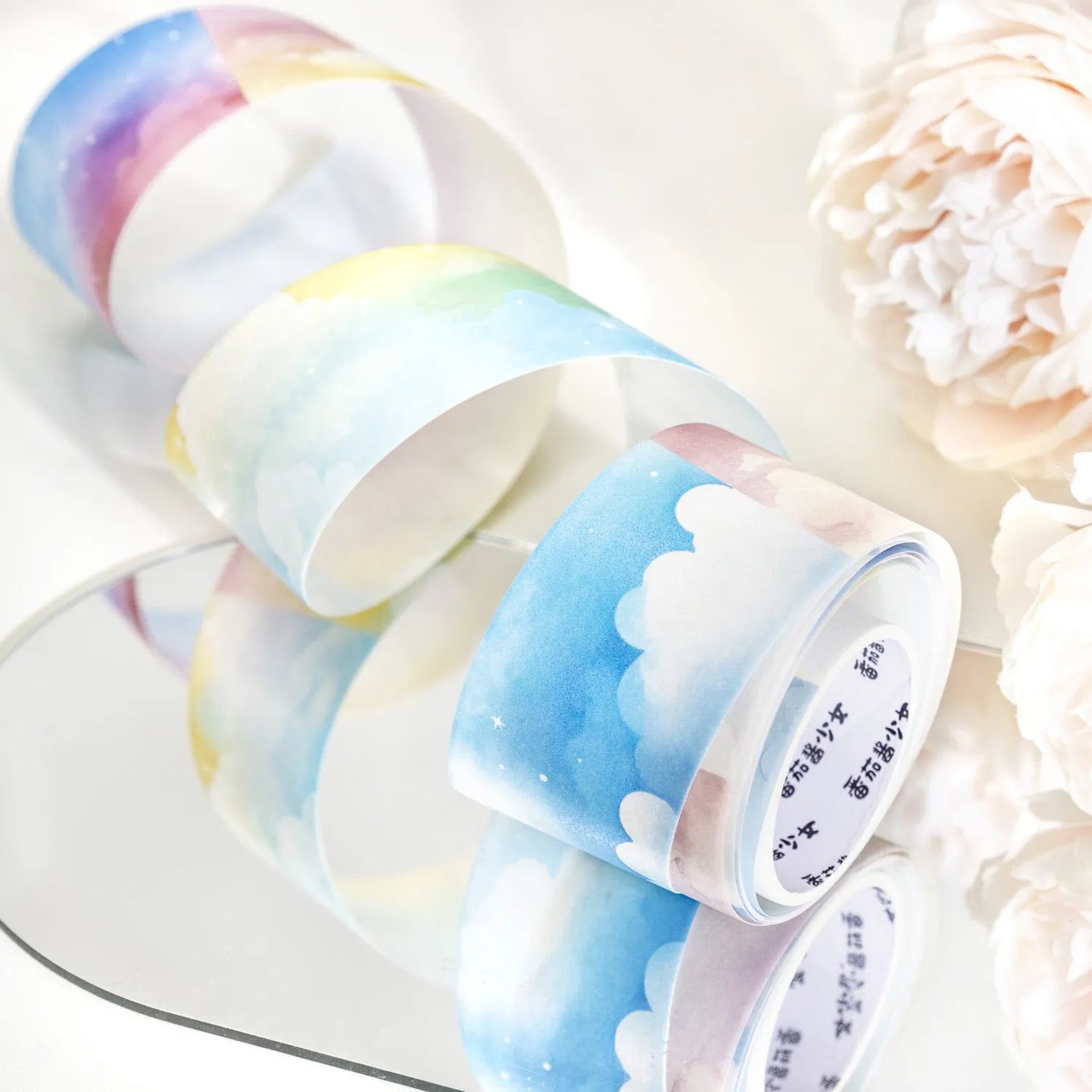 Japanese paper washi tape roll with sky theme designs including clouds, sun, twilight, moon, and nebula