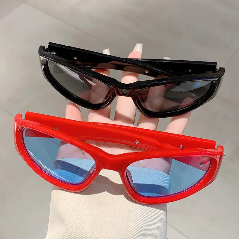 Sports sunglasses with a polycarbonate frame and lenses, shown in a choice of colours including black, red, and transparent gray.