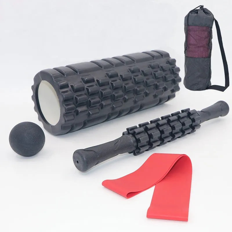 Black fitness foam roller massage bar measuring 33cm long on a plain background.