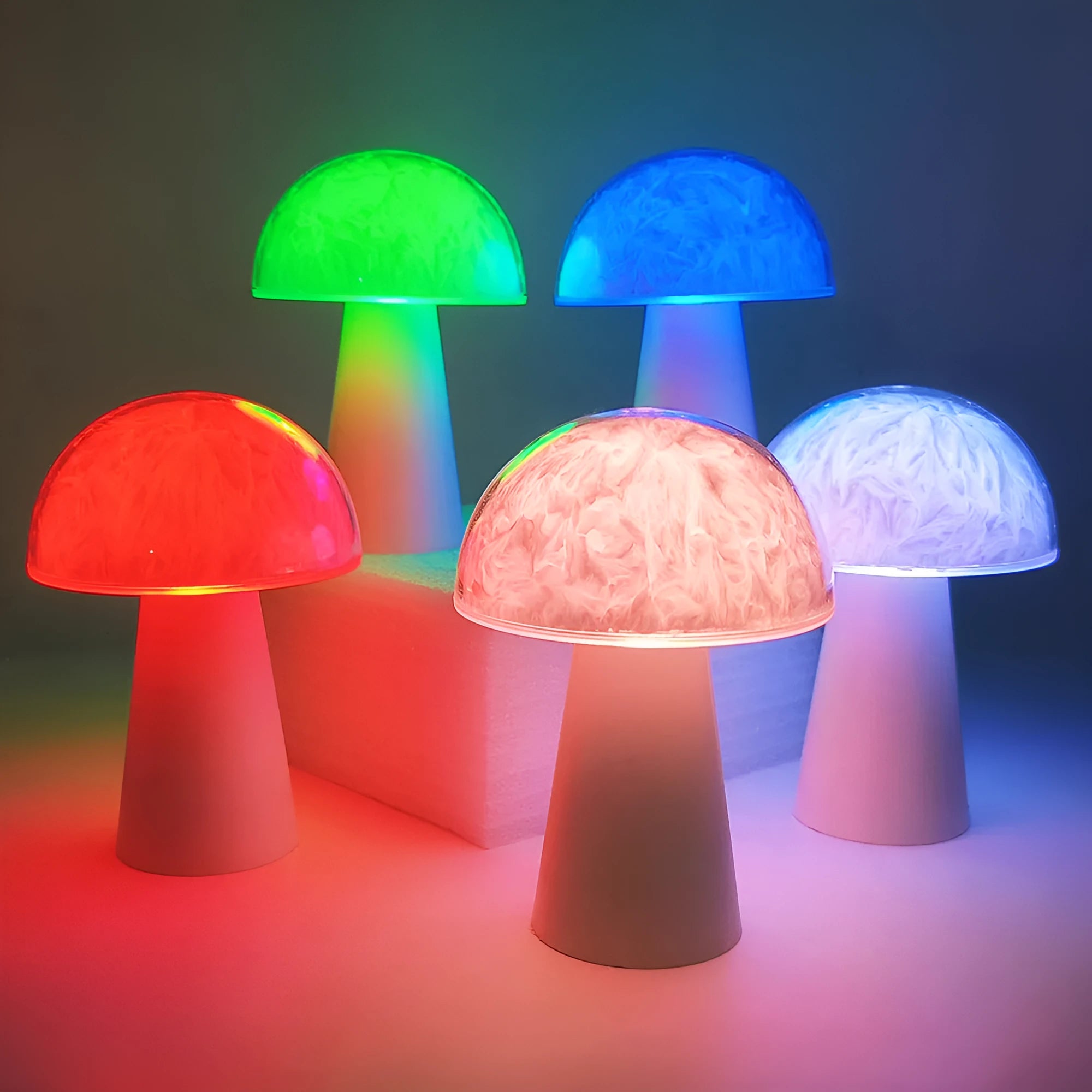 Mushroom-shaped RGB colour-changing night light with remote control on wooden surface