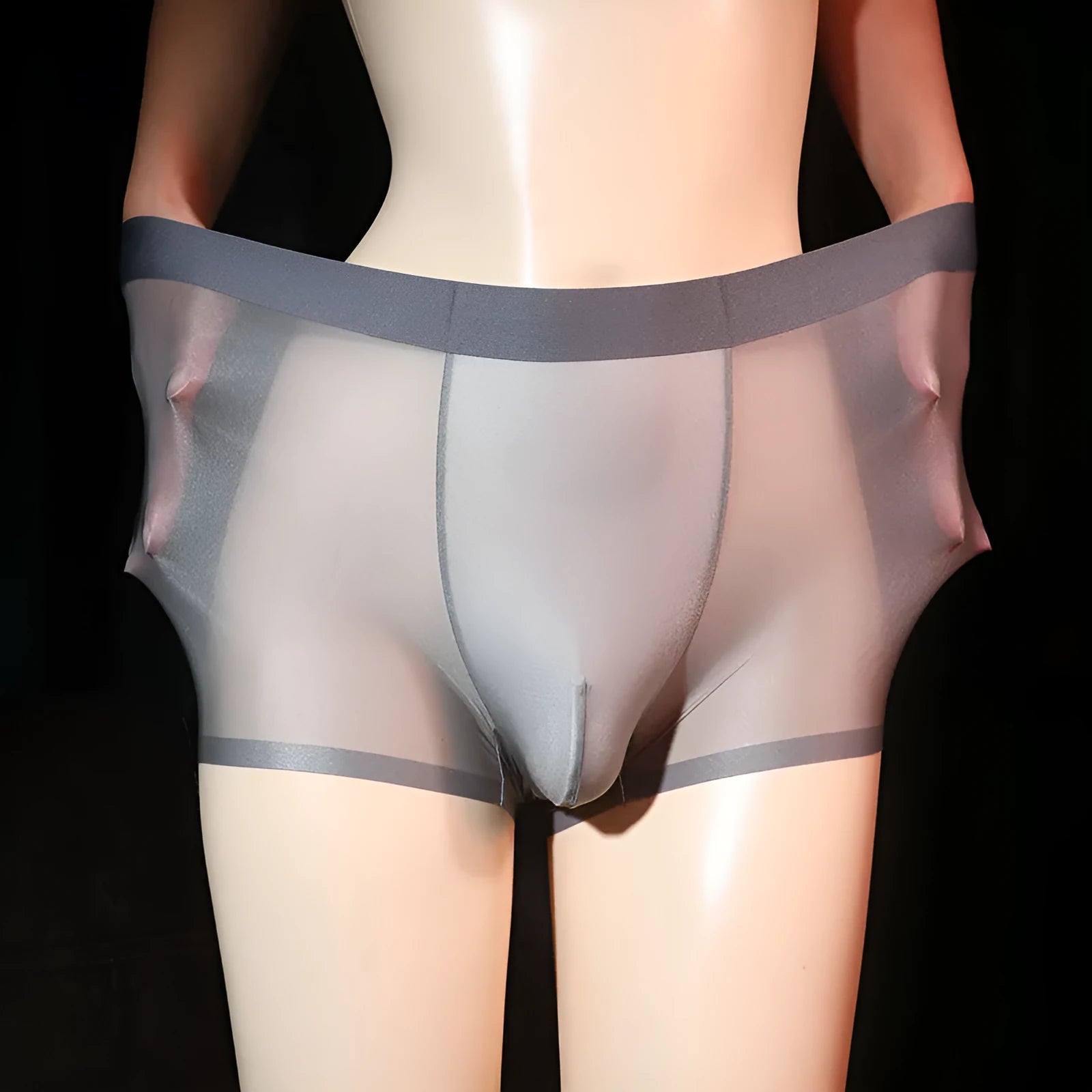 Men's ultra-thin light gray nylon boxer underwear laid flat, showing solid colour design.