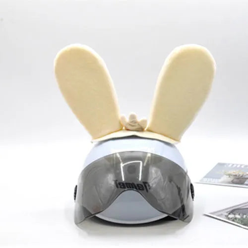 Rabbit Glow Ears helmet decoration with locomotive and ski designs on a Velcro base