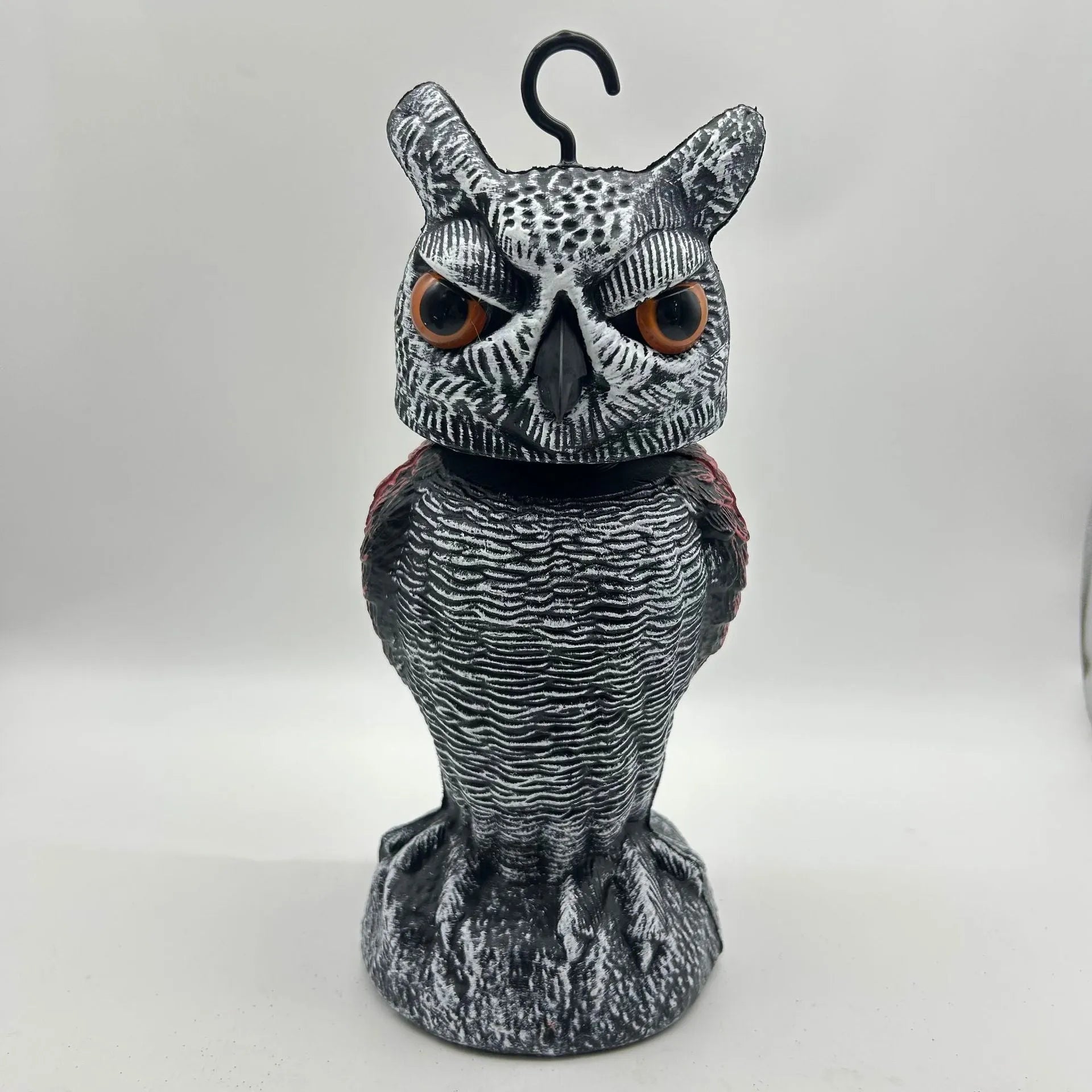 Realistic plastic artificial owl bird deterrent ornament with shaking head, for outdoor use.