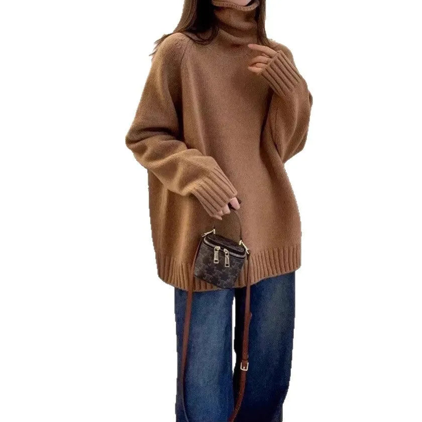 Women's loose grey turtleneck sweater with a thick, textured curling pile collar.