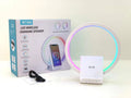 White smart Bluetooth speaker with integrated ambient lighting and a 15W wireless charging pad on top.