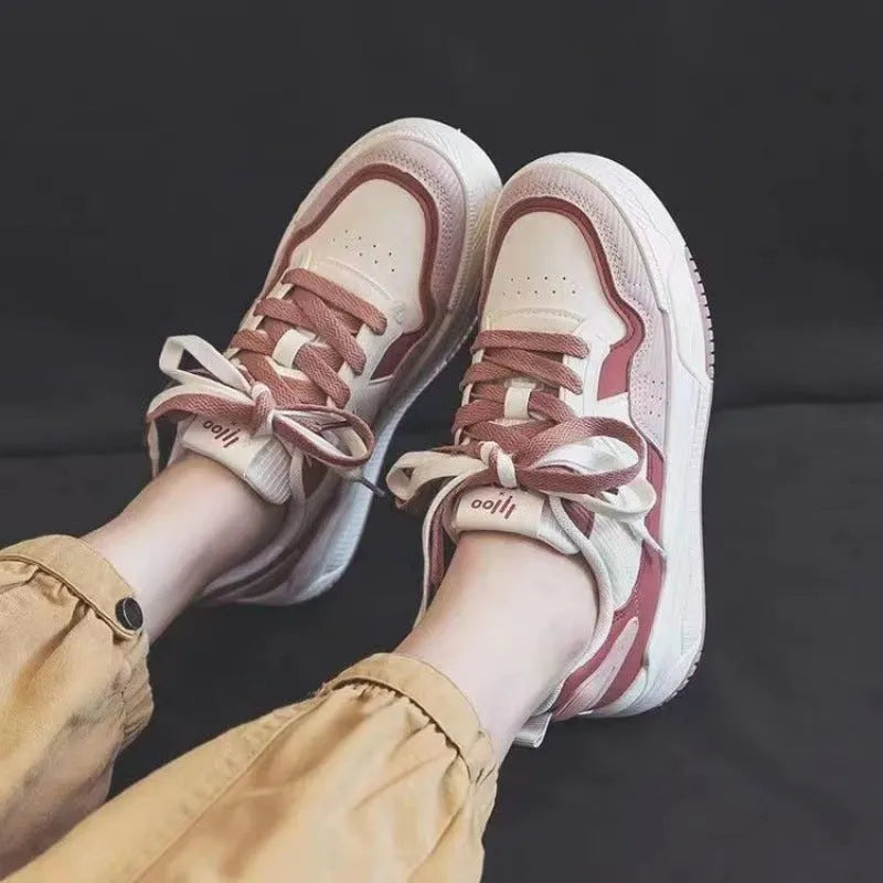 Women's pink and white height increasing rubber sneakers with low-top design