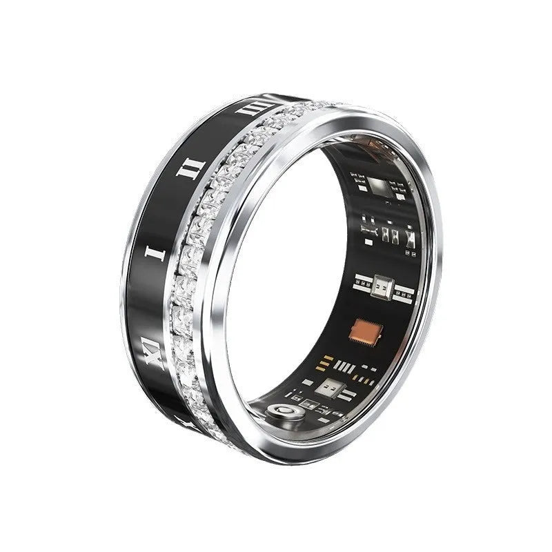 Silver and gold smart ring with diamond inlay on finger, showing charging cable and box.