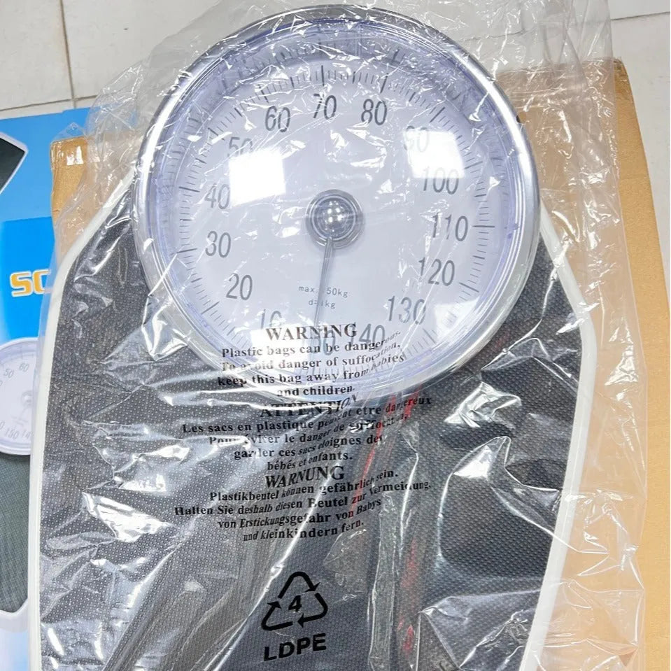 Black mechanical bathroom scale with large analogue dial on a 47x35cm platform.