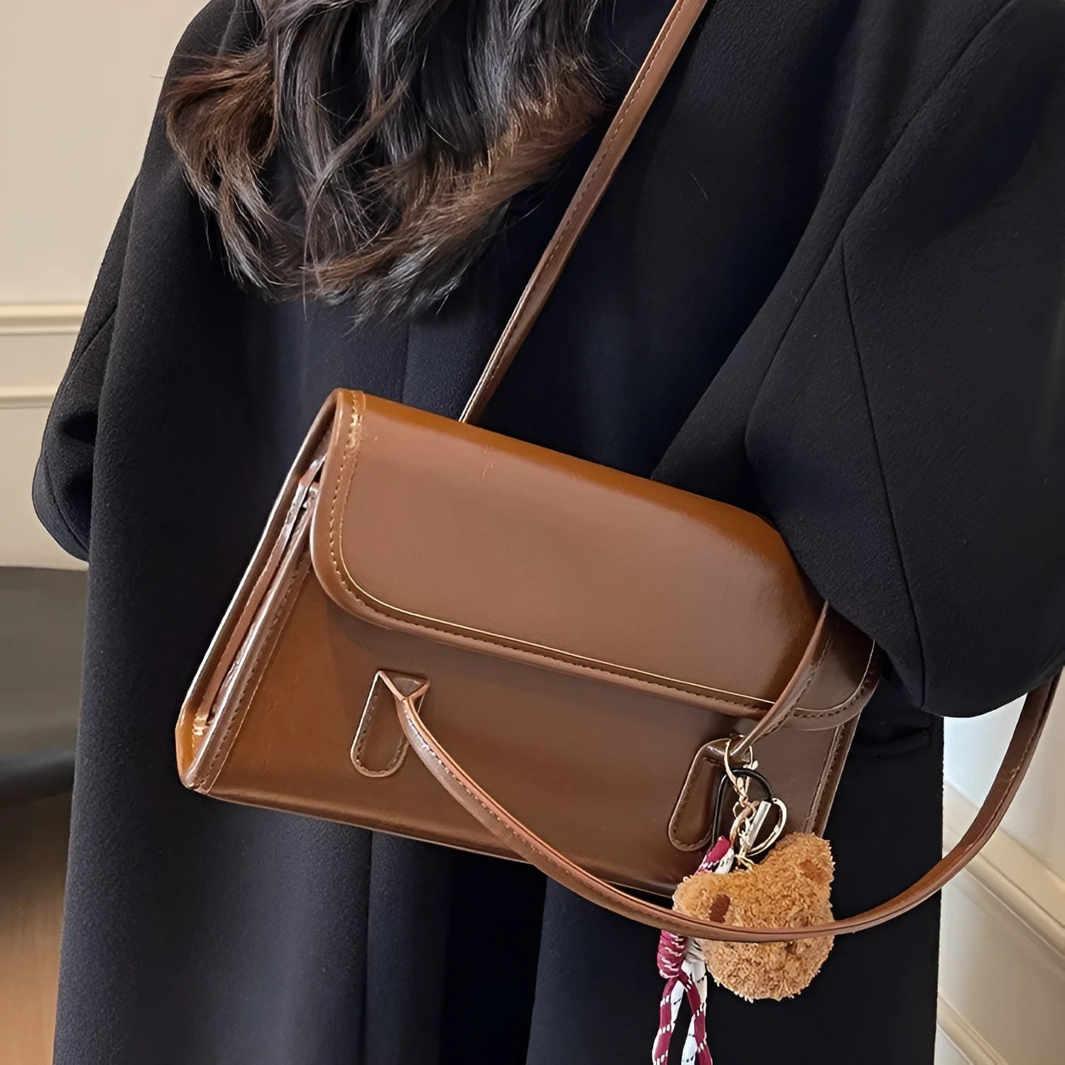 Women's brown PU Maillard shoulder bag with pendant detail, showing horizontal square shape and double straps.