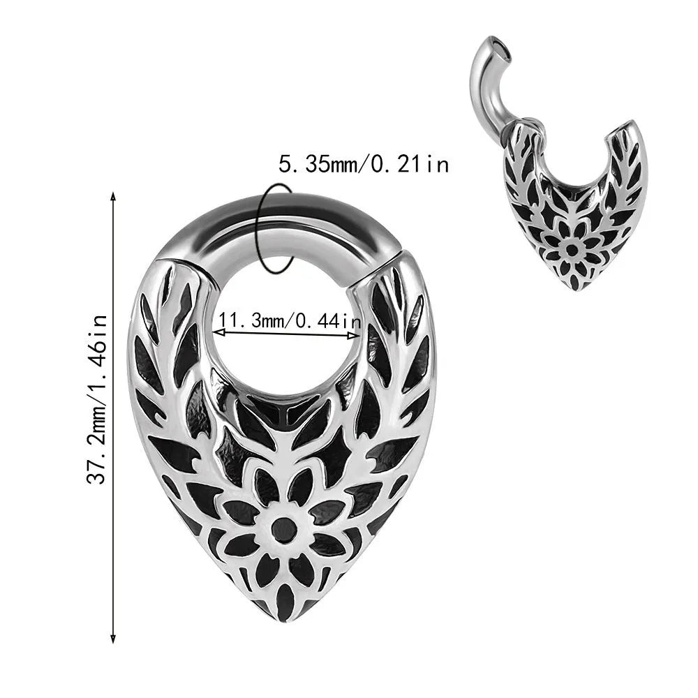 Drop-shaped stainless steel ear extender with totem pattern and hanging egg detail.