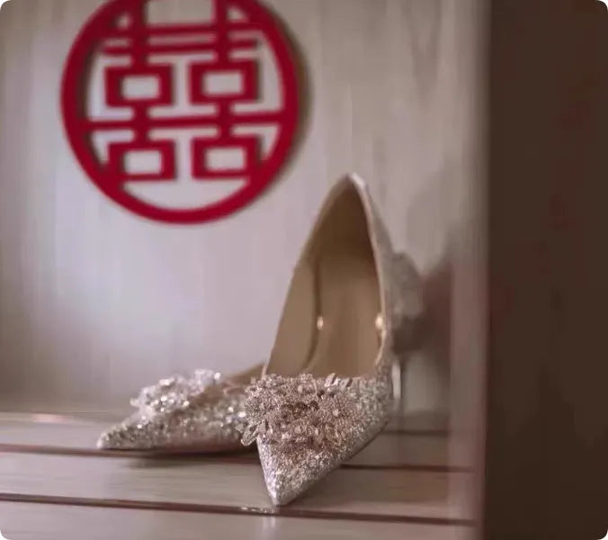 Champagne coloured wedding shoes with crystal flower pattern and pointed toe