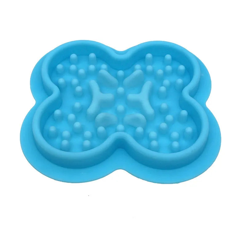 Silicone pet licking pad slow feeder mat in blue on a kitchen floor