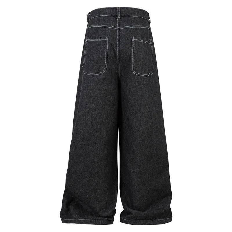 Black pleated mid-waist cotton denim jeans with multi-pocket workwear style on a hanger.