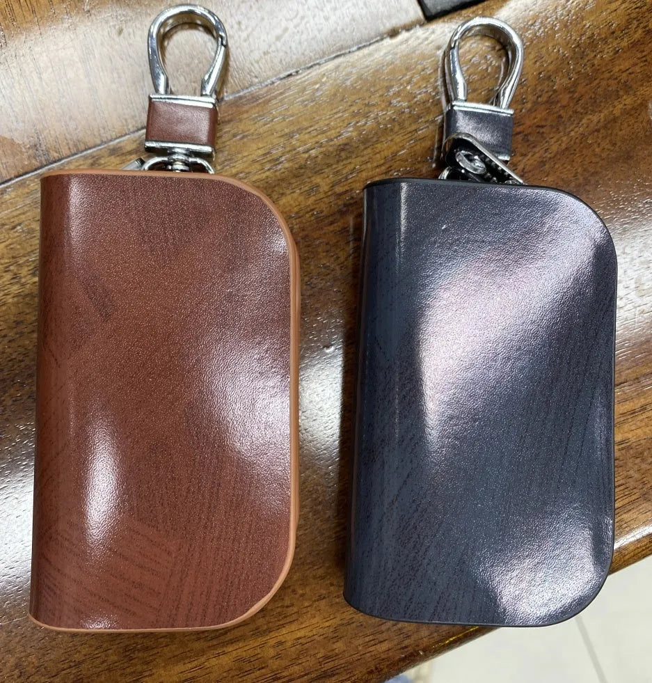Genuine leather car key case in frosted black or brown with zipper closure