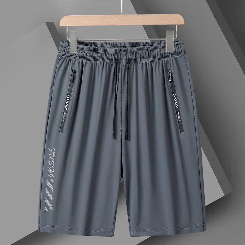 Men's black loose-fit nylon sports shorts with elastic waistband on a hanger