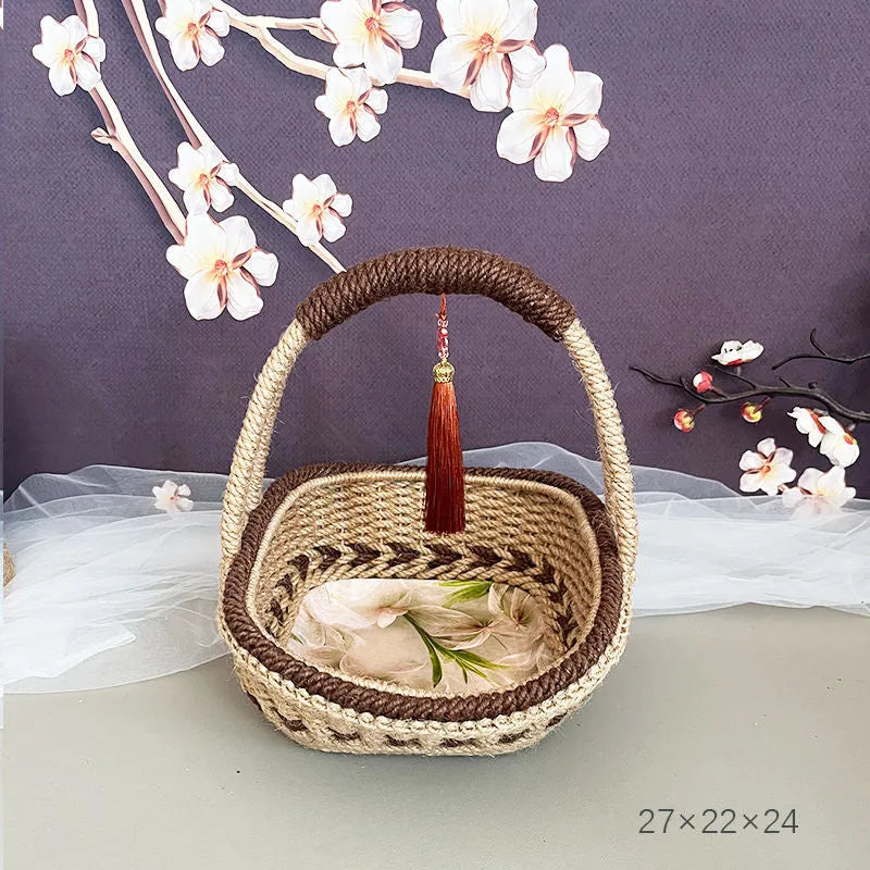 A hand-woven straw basket in a coffee brown colour, measuring 19cm by 12cm.