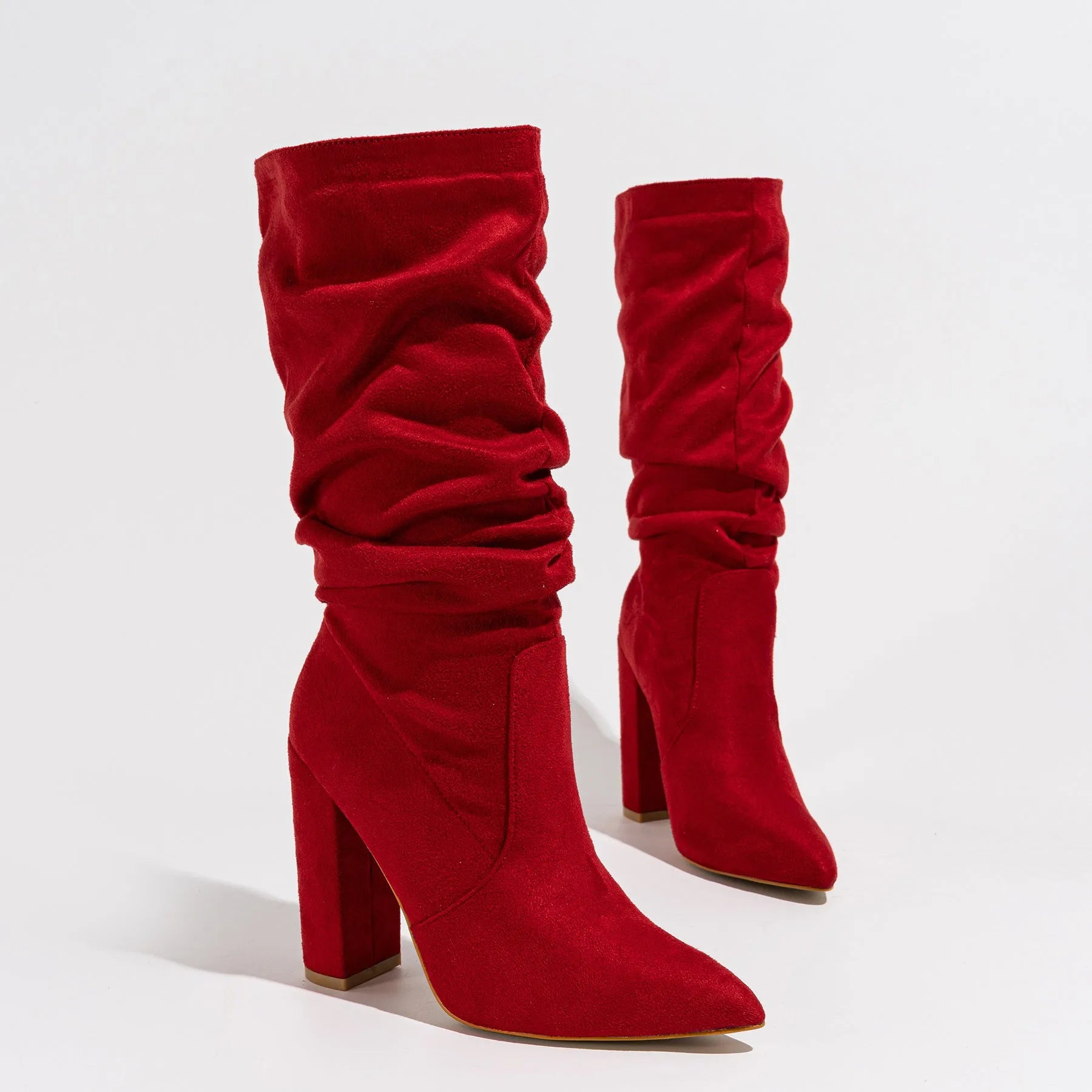 Women's black suede chunky heel boots with pointed toe and mid-calf shaft.