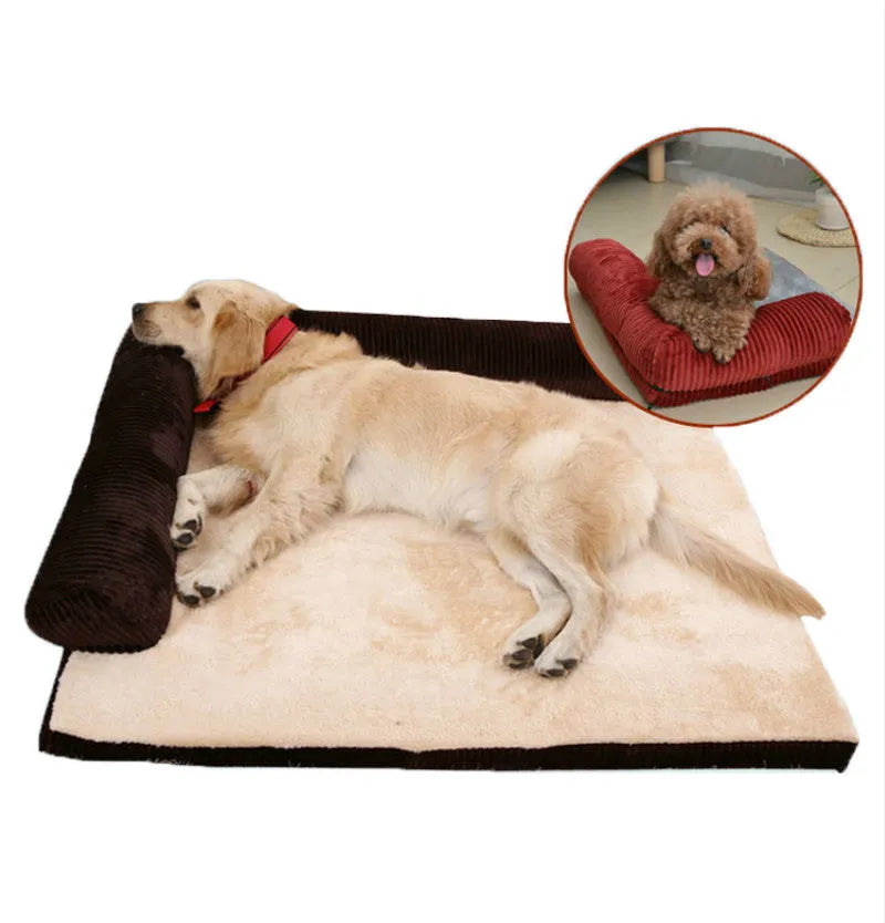 Corduroy pet sofa dog bed with bolster, shown in a grey colour on a wooden floor.