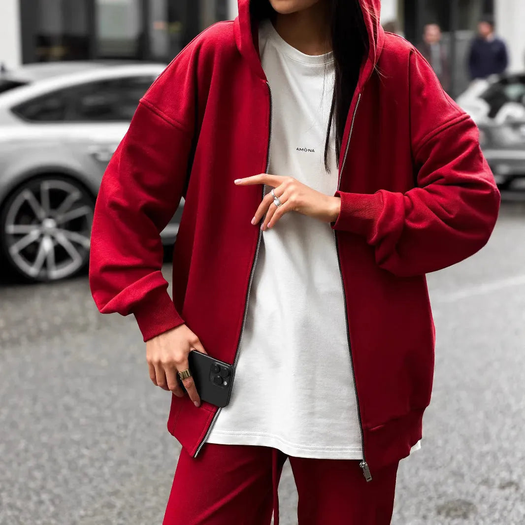 Red street style two-piece set with long-sleeved coat and trousers on clothing rack